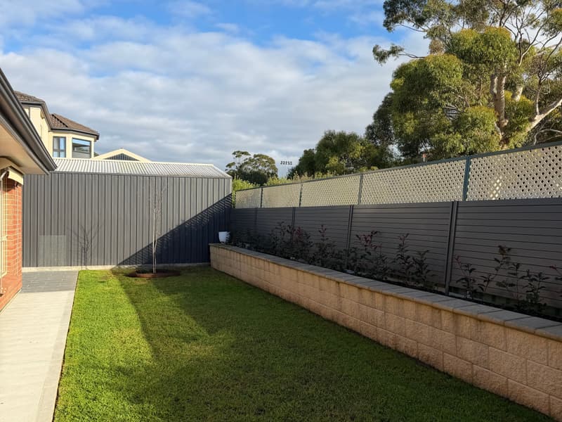 Neatly mown courtyard lawn behind a home in Oakden, Adelaide