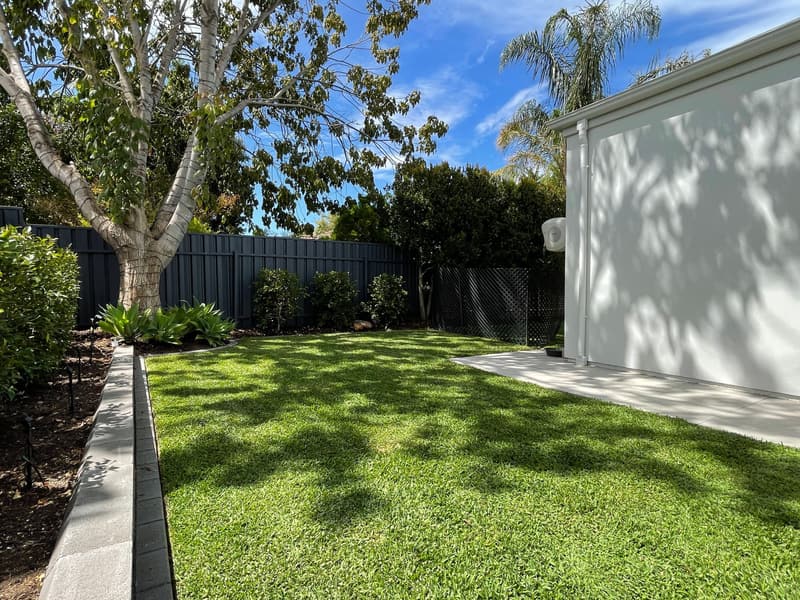 Freshly mown residential lawn beside a garage in Oakden, Adelaide